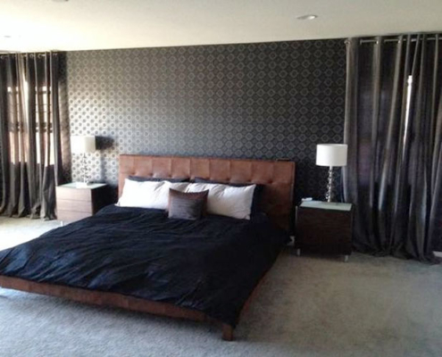 Bedroom with sophisticated wallpaper